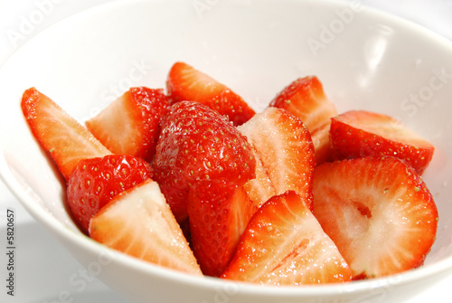 delicious bowl of fresh strawberries with sugar