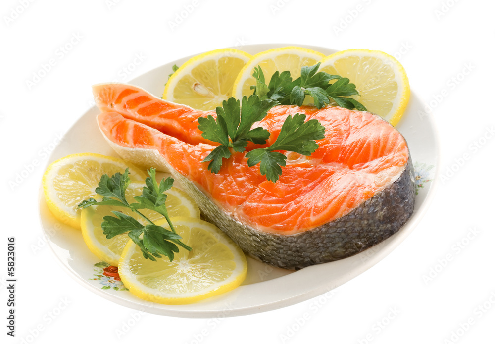 salmon with lemon on plate isolated on white background salmon with lemon on plate isolated on white background
