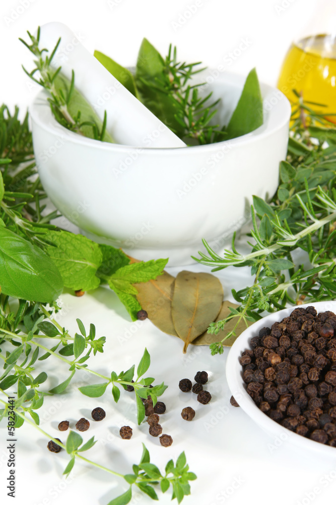 Mortar and pestle with fresh-picked herbs Mortar and pestle with fresh-picked herbs