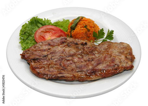 Fresh steak with potatoes and lettuce
