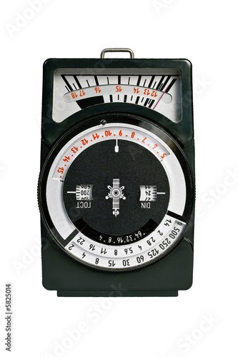 Old light meter isolated on white background.