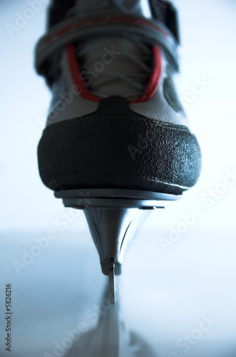 Hockey ice skate with reflection - back light