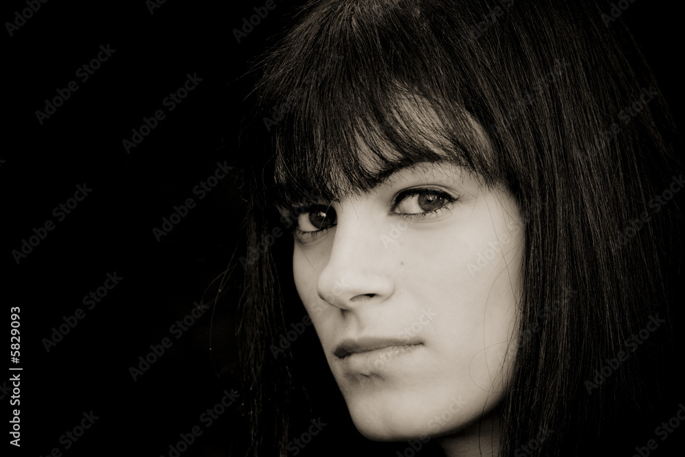 Fototapeta premium Woman portrait in darkness.