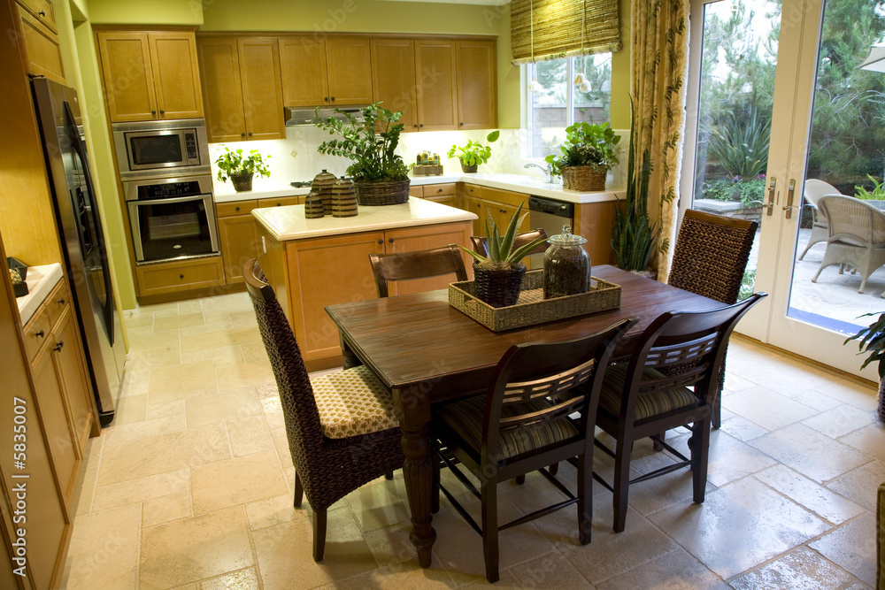 Kitchen with breakfast table and modern decor. 