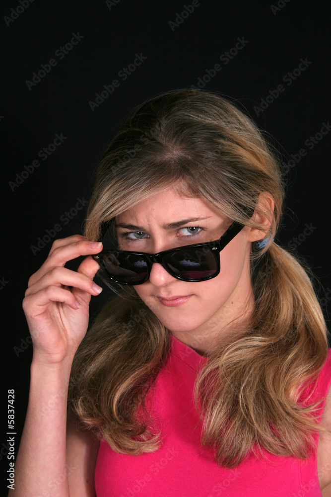 Looking with anger over sunglasses Looking with anger over sunglasses