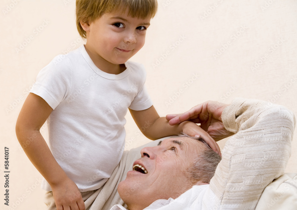 Adult senior play about with his grandchild Adult senior play about with his grandchild