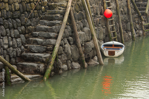 Photography Small white dinghy and bright orange buoy