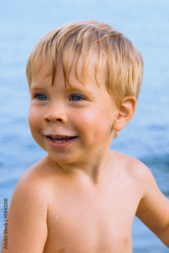 Smiley boy with water drops on face Smiley boy with water drops on face
