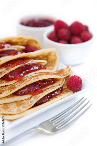 Pancakes with raspberry jam & fresh raspberries - shallow dof