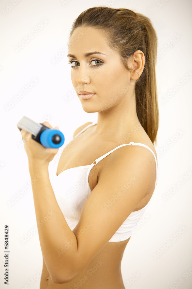 Young beautiful woman during fitness time and exercising Young beautiful woman during fitness time and exercising