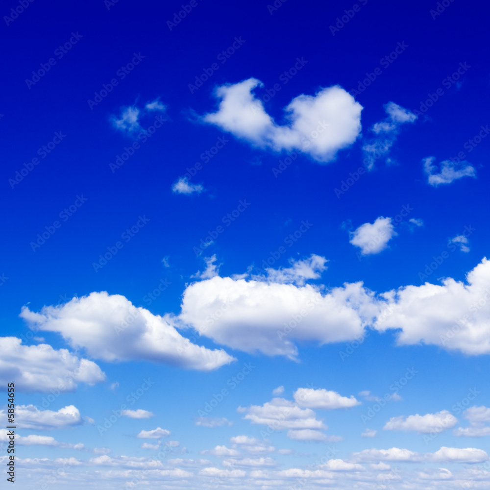 White fluffy clouds in the blue sky. White fluffy clouds in the blue sky.