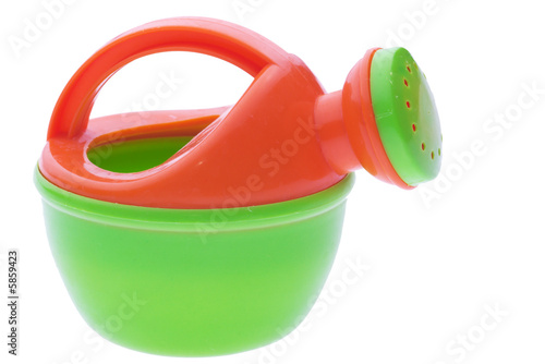 toy plastic watering-pot isolated on white