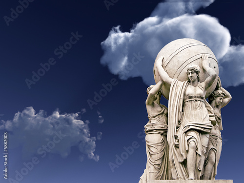 Allegorical statues about admiralty on a sky  background.  photo