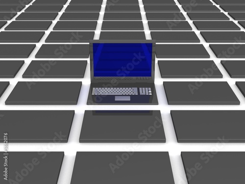 One open laptop among close...