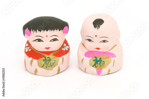 Chinese traditional boy and girl figurines on white background