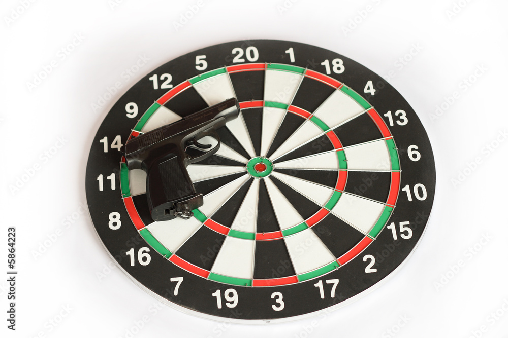on photo darts and black gun. Isolated on photo darts and black gun. Isolated