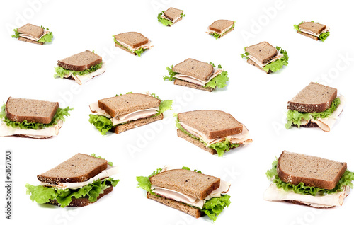 A fresh deli sandwich with lots of meat and green lettuce