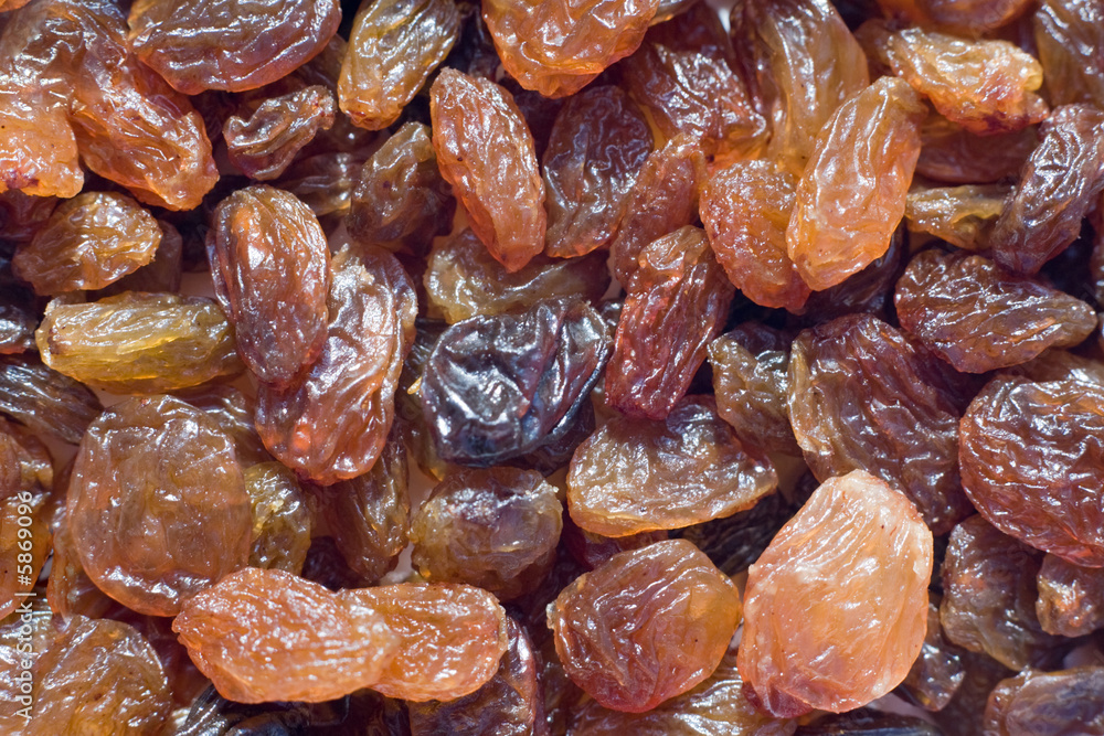 closeup on many sweet dry raisins, food background closeup on many sweet dry raisins, food background