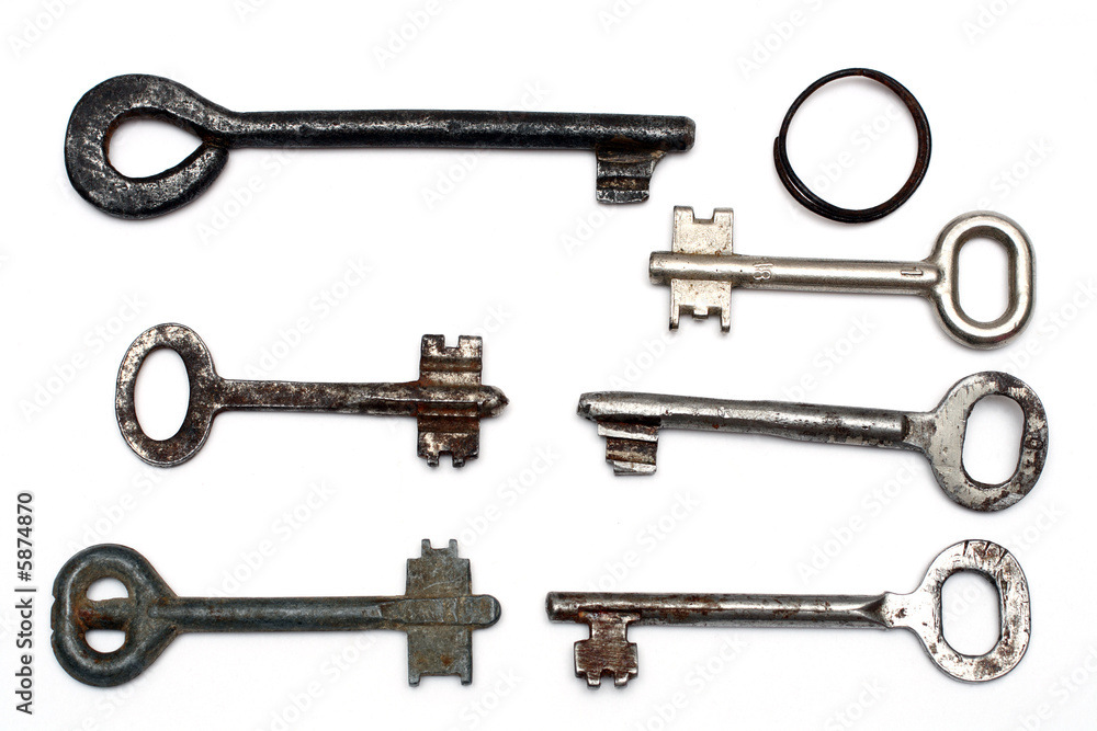six old rusty keys and keyring isolated on white six old rusty keys and keyring isolated on white