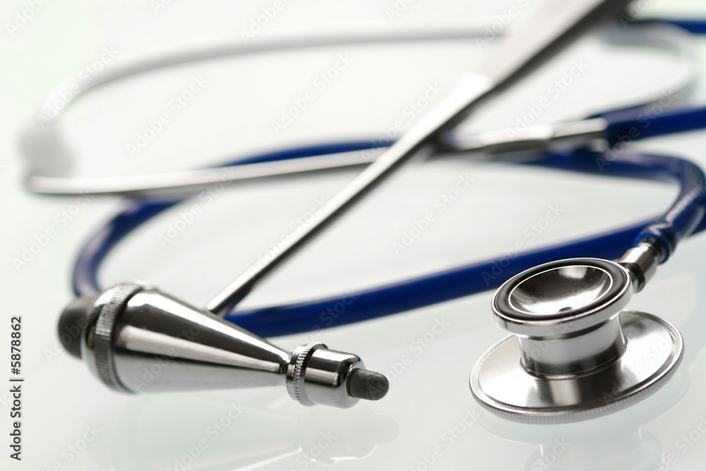 stethoscope and of medical hammer on glass background stethoscope and of medical hammer on glass background