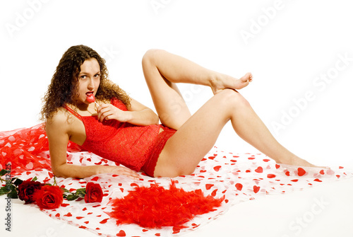 Erotic girl in red with lollie-pop