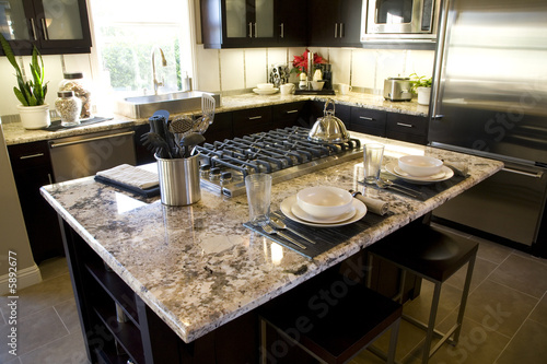 Luxury kitchen with a modern granite island.