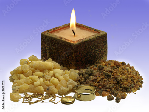 Frankinsence and myrrh with gold jewellery and candle