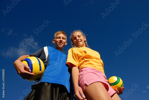 Teenagers with soccer balls