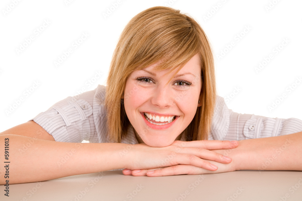 Smiling Young Woman Lying on a Desk Smiling Young Woman Lying on a Desk