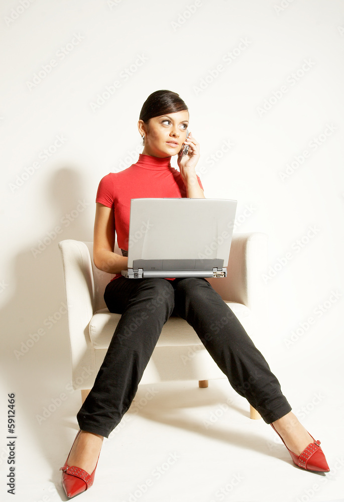 Atractive brunet businesswoman with Laptop and phone Atractive brunet businesswoman with Laptop and phone