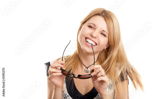Pretty blonde woman with sun glasses on white background