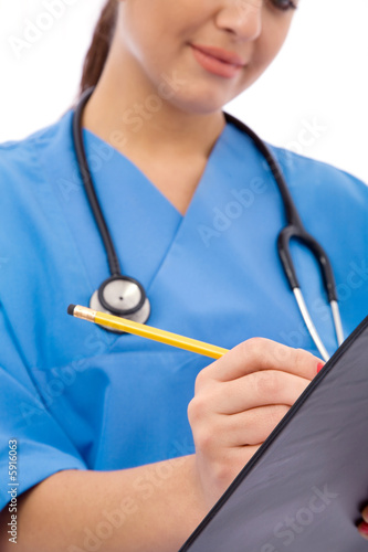 female medical doctor taking notes on white background