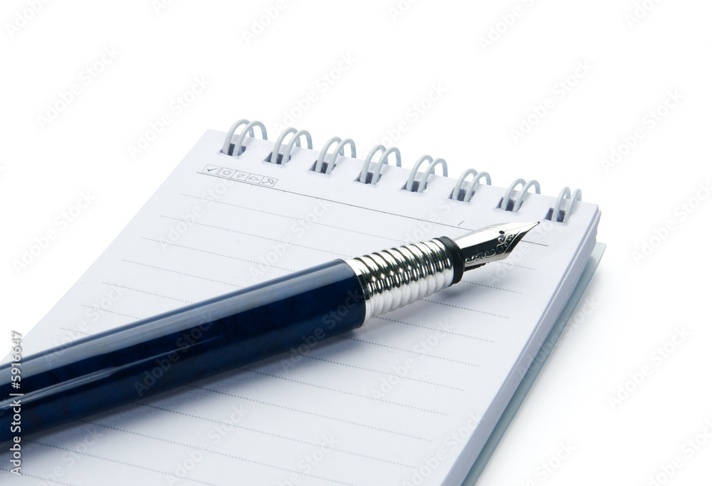 Pen on notebook, isolated on white background. Pen on notebook, isolated on white background.