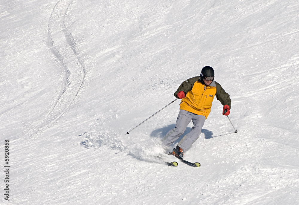skier man moving down in yellow suit