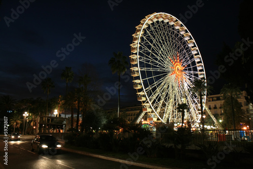 Ferris wheel at the city square of Nice at late evening.