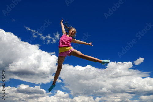 Acrobatic girl in midair