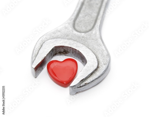 Wrench for heart. On a white background