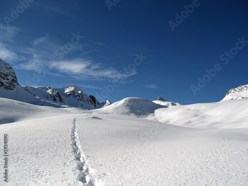Path on the snow on high mountain