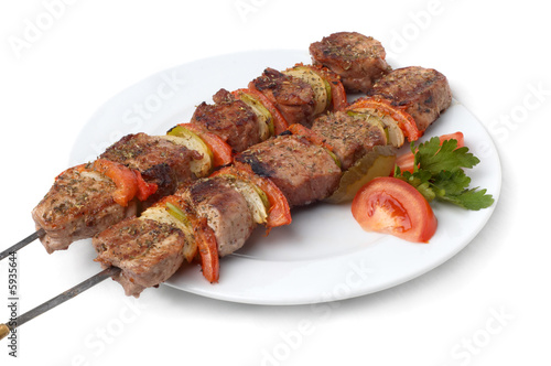 weal kebab on skewers, isolated on white