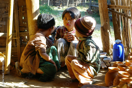 asian children in wooden house