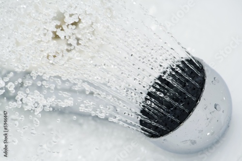 Shower head and running water in the bathroom