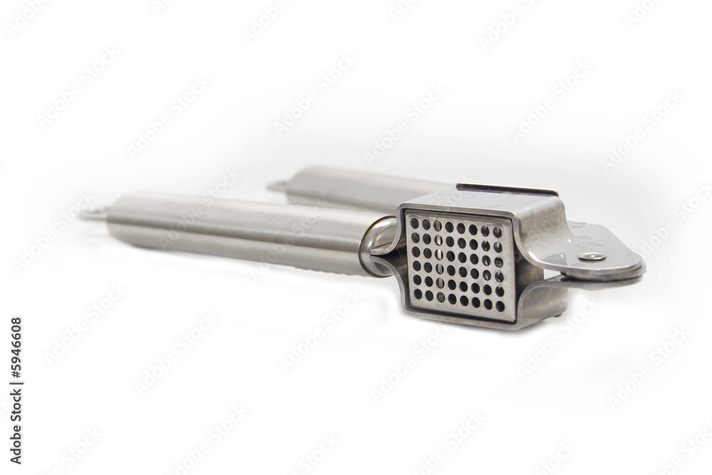 silver garlic press isolated on white silver garlic press isolated on white