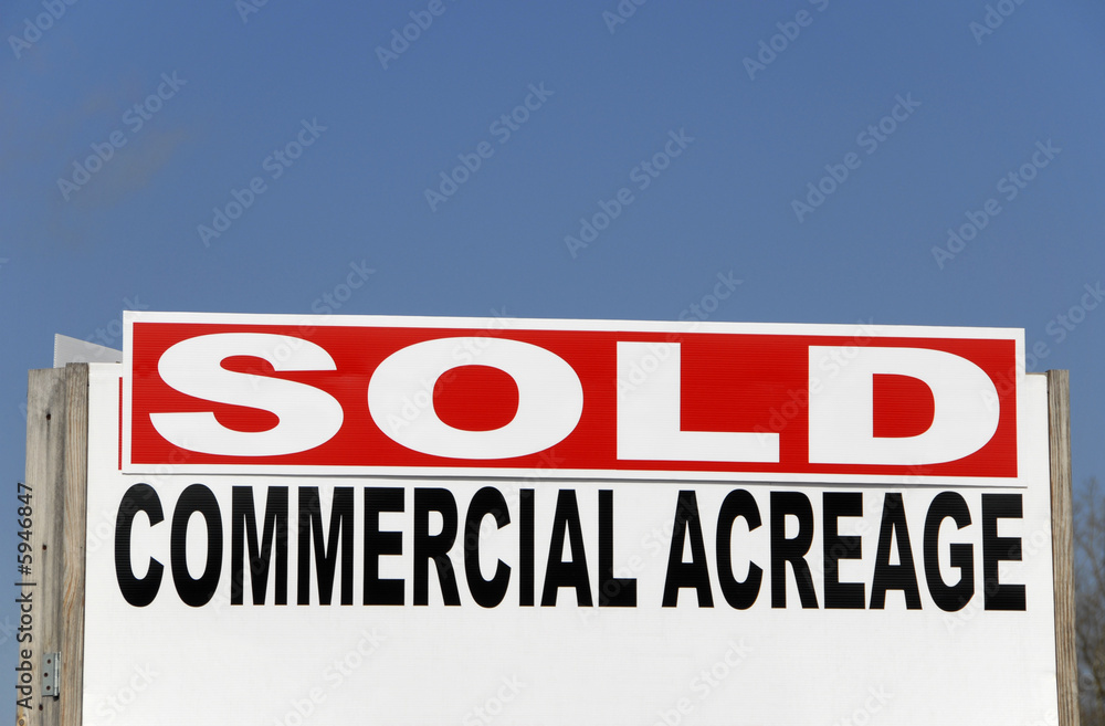 A realtor SOLD Sign on commercial property