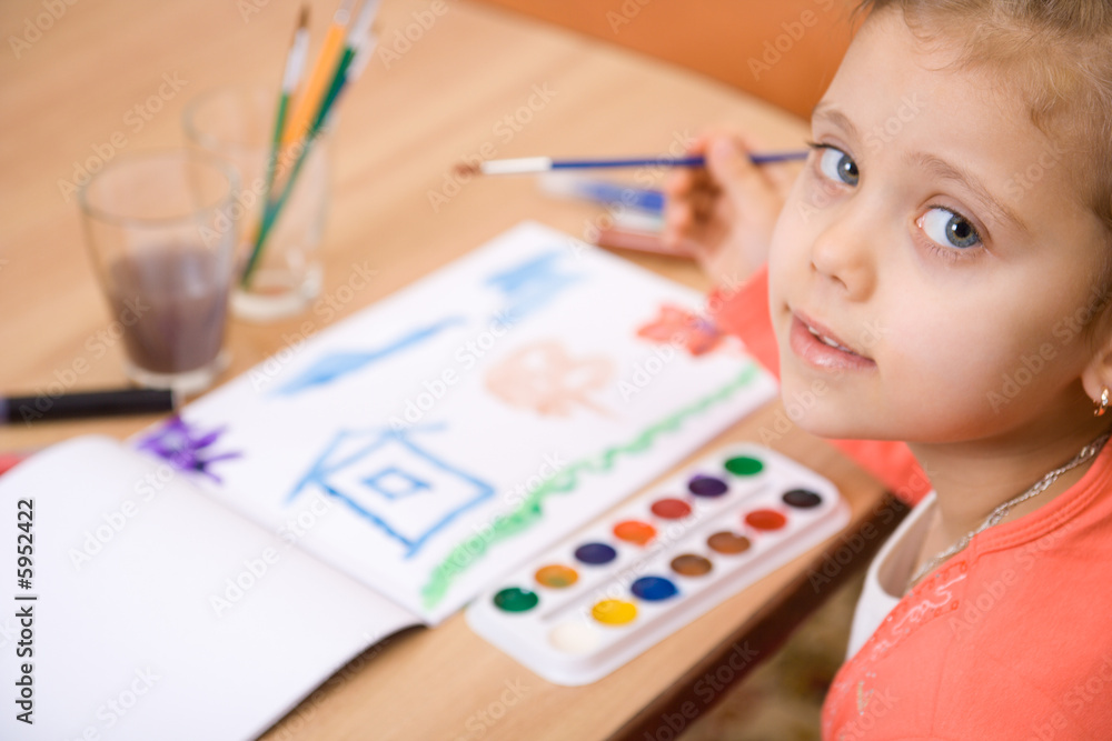 Pretty caucasian girl watercolor paint and look in camera. Pretty caucasian girl watercolor paint and look in camera.