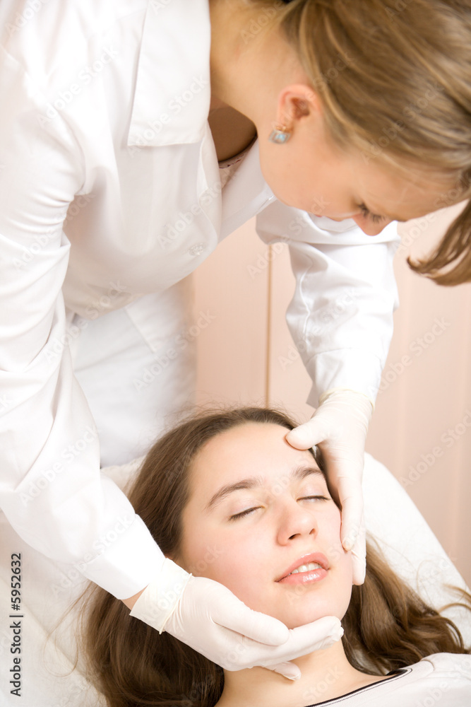 Doctor beautician explored face of young women Doctor beautician explored face of young women