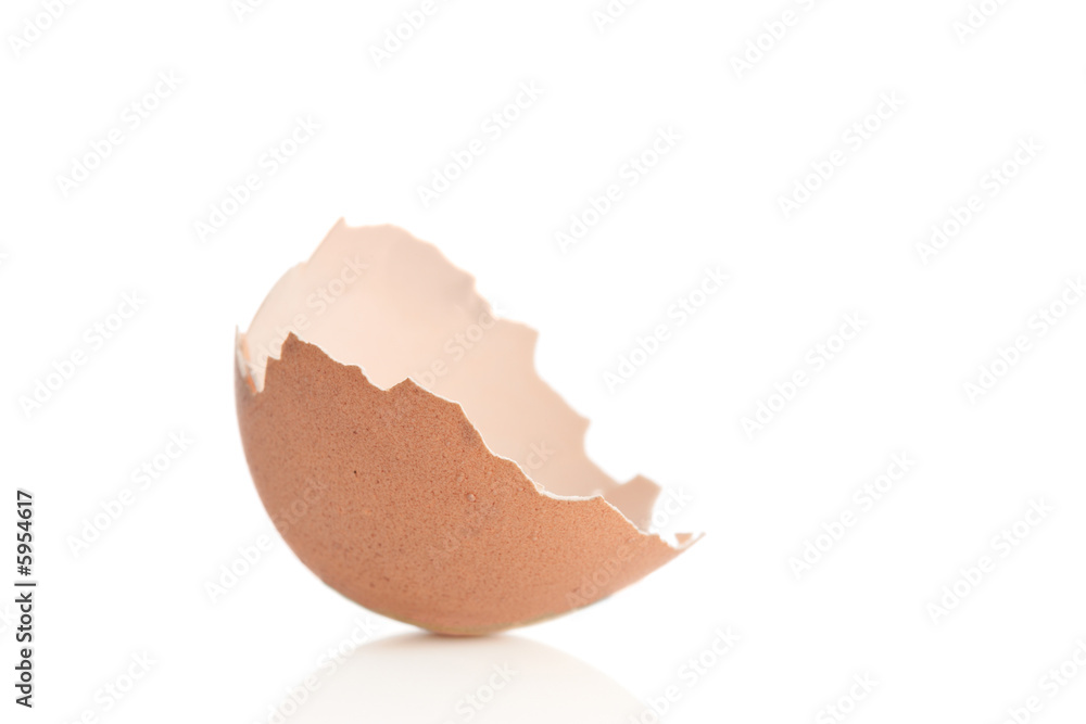 Broken eggshell against white background Broken eggshell against white background