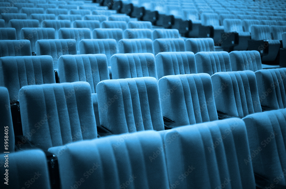 Naklejka premium Empty chairs at cinema or theater. Blue Tone