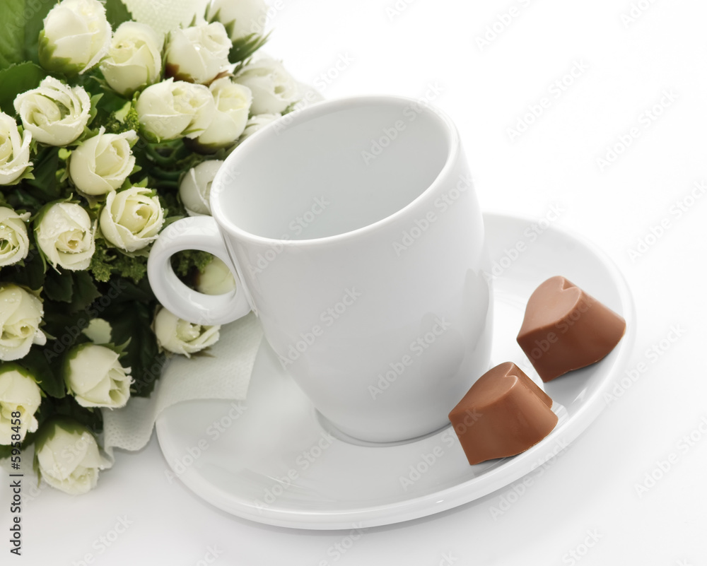 A bunch of flowers, coffee-cup and a pair heart of chocolate. A bunch of flowers, coffee-cup and a pair heart of chocolate.
