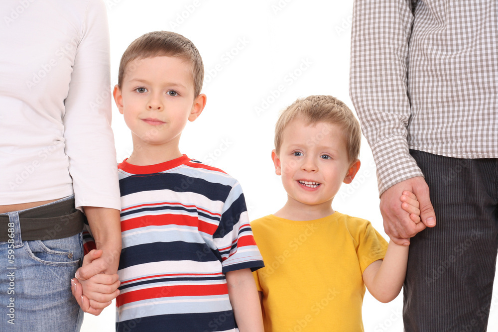 two brothers with their parents isolated on white two brothers with their parents isolated on white