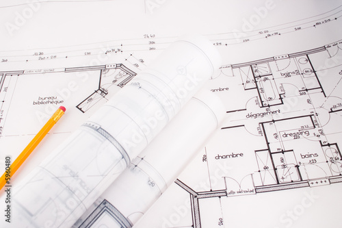 Plans of a house designed by an architect with a yellow pencil